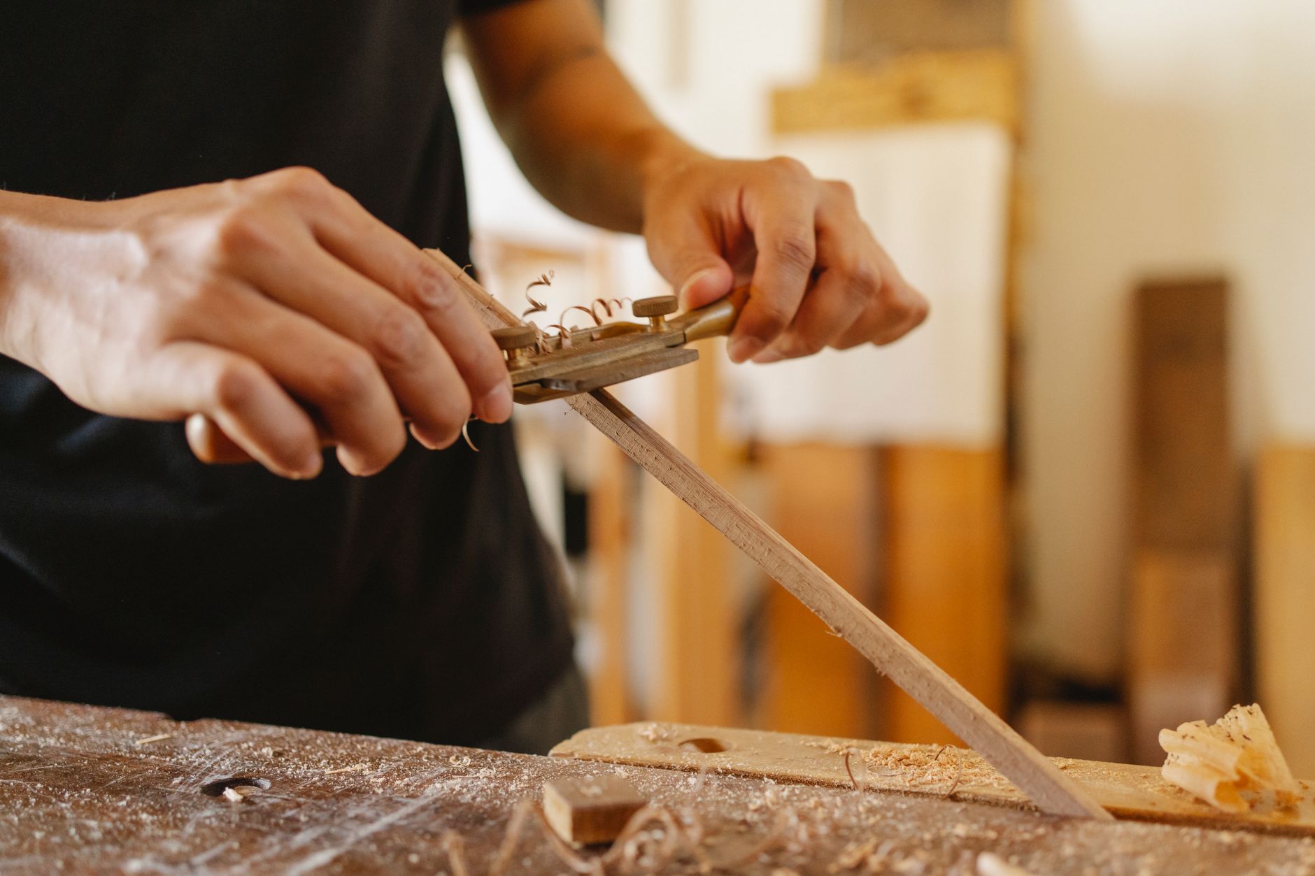 Hand-planing timber in the workshop